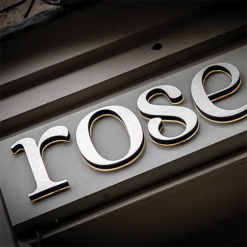 Backlight brushed metal signage